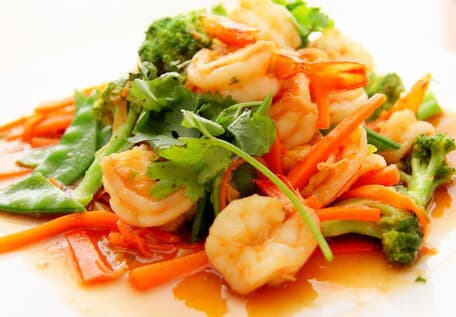 A plated prawn stir-fry dish